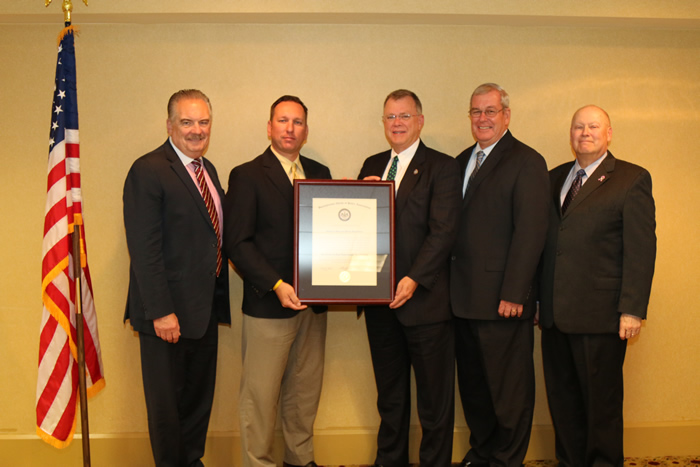 Sgt. Steve Borosky and Chief Randy Cox receive a plaque