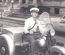David Metzgar riding the Police Department's Harley-Davidson "three-wheeler"